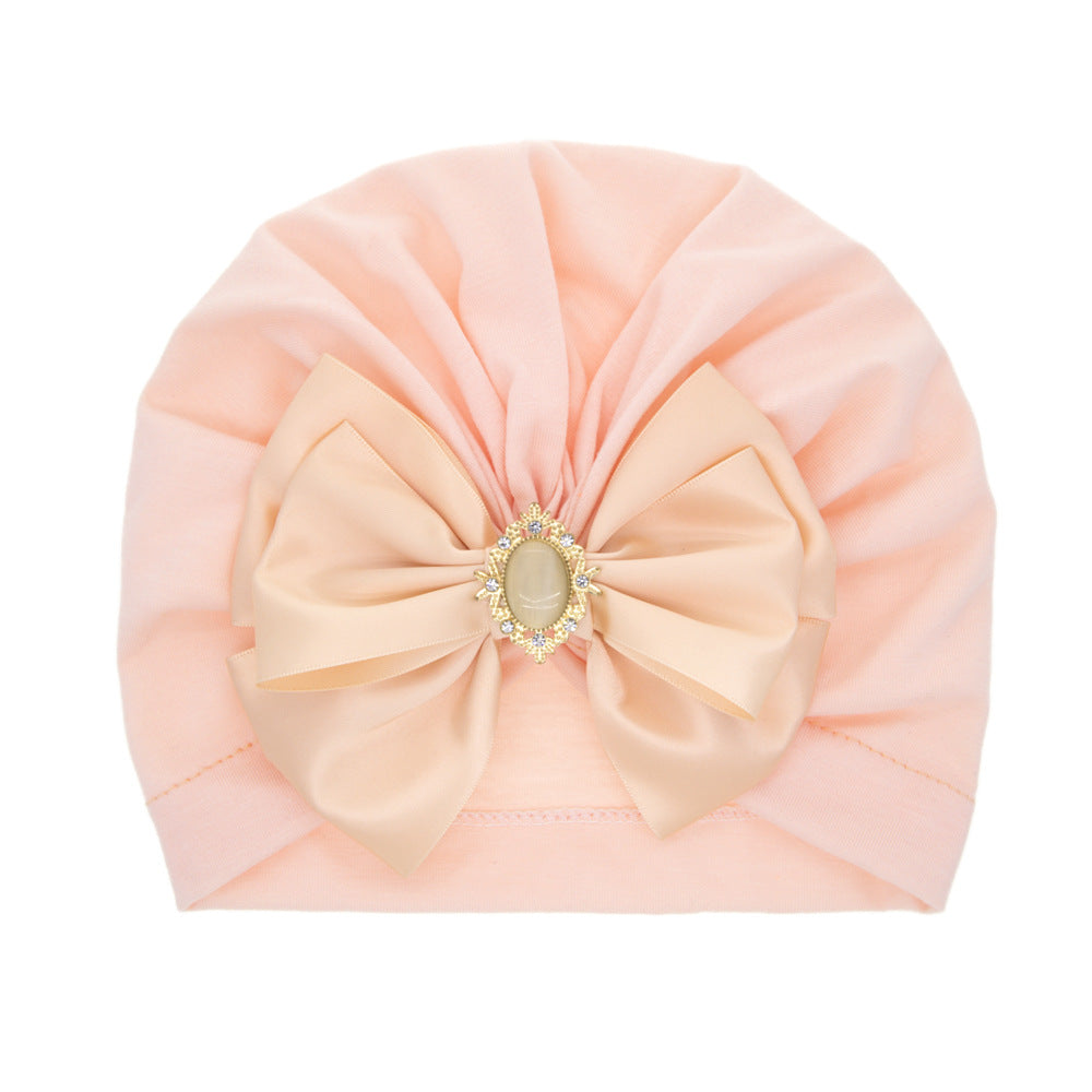 children's solid color rhinestone bow pullover hat, baby cap with bow, snow bud (ribbon style), imported from china